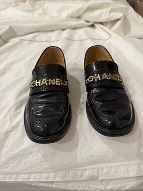 CHANEL Black Patent Leather Logo Strap Slip-On Loafers